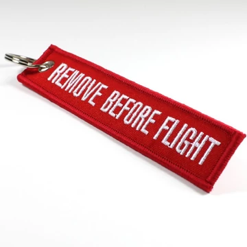 Remove Before Flight key ring - red